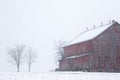 Red Barn during Winter Snowstorm in Pennsylvania Royalty Free Stock Photo