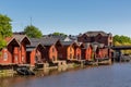 Old red wooden buildings on the river in Porvoo, Finland