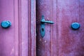 Red wooden entrance door with antique door handle Royalty Free Stock Photo