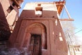 An old house made from reddish stone in Abyaneh Village, Iran.