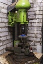 An old reliable drilling machine in the workshop, metalworking, machine tools