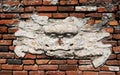 Old remains of a sword lion on a brick wall in Anping Tainan Taiwan