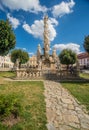 Old renaissance architecture and a baroque monument in market square Telc in Czechia.