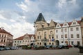 Old Renaissance Town hall with clock tower and Hussitism museum on main square, Late gothic tracery gable on historical building,