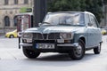 Retro Renault car parked in public parking 