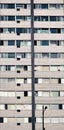 Old residential building facade with windows and air conditioners Royalty Free Stock Photo