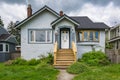 Old residential house with neglected lawn on the front yard. Royalty Free Stock Photo