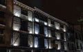 Old restored brick facade with lighting in the central square ca