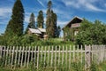 An old restored church next to a retro vintage house. Crosses on the roof. The concept of travel in Russia. One of the Royalty Free Stock Photo