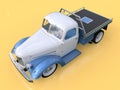 Old restored pickup. Pick-up in the style of hot rod. 3d illustration. White and blue car on a yellow background. Royalty Free Stock Photo