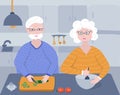 Old retired couple cook together a vegetable salad on the cozy kitchen