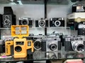 Old retro aged equipment, photo, film cameras in shop-window.