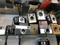 Old retro aged equipment, photo, film cameras in shop-window.
