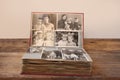 Old retro album with vintage monochrome photographs in sepia color, the concept of genealogy, the memory of ancestors, family ties Royalty Free Stock Photo