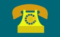 Old, retro, antique, ancient, vintage, hipster, yellow, golden disk phone with a tube on a dark blue background. Royalty Free Stock Photo