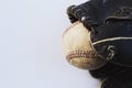 Old retro baseball glove with ball on white background Royalty Free Stock Photo