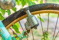 Old retro bicycle front macro view with dynamo, front wheel and headlight. Royalty Free Stock Photo