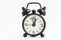 Old retro black alarm clock on isolated white background Royalty Free Stock Photo