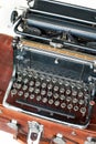 Old retro black metallic typewriter with antique round keys. Royalty Free Stock Photo