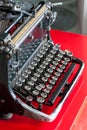 Old retro black metallic typewriter with antique round keys. Royalty Free Stock Photo