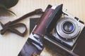 Old retro camera on aged photo album Royalty Free Stock Photo