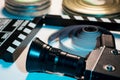 Old retro camera, film clapper, rolls of film and a 35mm box films Royalty Free Stock Photo