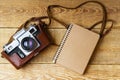 Old retro camera on vintage rustic wooden planks boards. Education photography courses back to school concept abstract background Royalty Free Stock Photo