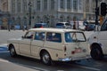 Old retro car with cheerful Unrecognizable crew