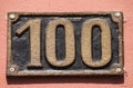 Old retro cast iron plate number 100