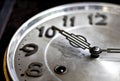 Old or retro clock winding, close-up hands and face of the old m Royalty Free Stock Photo