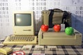 An old retro computer stands on the table. Apple and engineer technology.