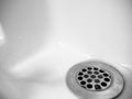 Old retro drain with water droplets