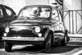 Old retro Fiat 500 in Rome street. black and white image Royalty Free Stock Photo