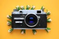 Old Retro film photo camera and the words Summer time, and flowers, on a yellow background. Summer concept. Royalty Free Stock Photo