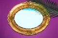 old retro frame with blue background, frame on purple background with palm leaf, creative summer design Royalty Free Stock Photo