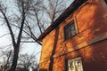 Old retro house wall with windows in sunset sunlight. Warm autumn day Royalty Free Stock Photo