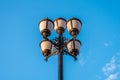 The old retro lamp post and the beautiful white and blue sky Royalty Free Stock Photo