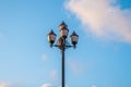 The old retro lamp post and the beautiful white and blue sky Royalty Free Stock Photo