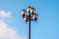 The old retro lamp post and the beautiful white and blue sky Royalty Free Stock Photo