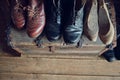 Old leather shoes and shoe lasts in a shoemaker workshop