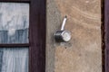 Old metal teapot nailed in wall of country house