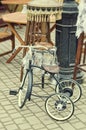 Old retro objects antique children's bicycle and floor lamp