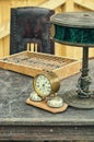 Old retro objects antique reading lamps, abacus and alarm clock on a wooden table