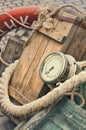 Old retro objects antique textural background wooden crates, chronometer and ropes