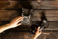 Old retro phone black and woman`s hand closeup,call on the phone