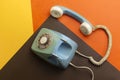 Old retro phone isolated on colorful background. Royalty Free Stock Photo