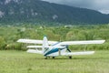 Old retro plane stands on mountain background Royalty Free Stock Photo