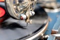 An old retro record playing on old vintage gramophone at flea market. Royalty Free Stock Photo