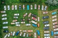 Old retro rusty abandoned cars in green grass, aerial top view from drone above cemetery of vintage autos Royalty Free Stock Photo