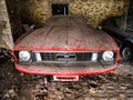 Old retro rusty car in village garage